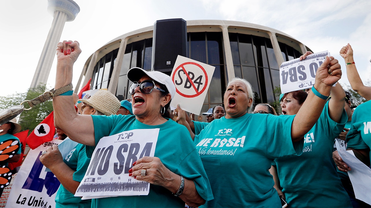 Photo of a group protesting against a new sanctuary cities