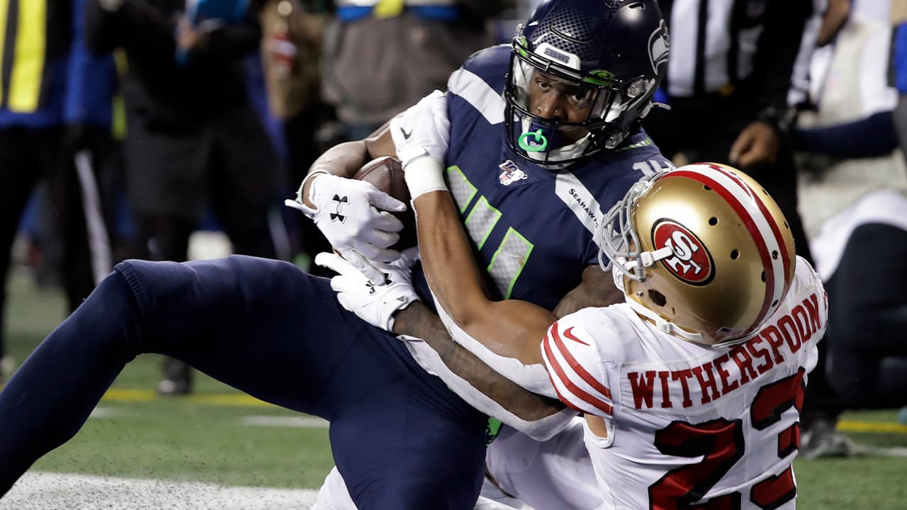 Photo of Seattle Seahawks' DK Metcalf, left, is wrapped up by San Francisco 49ers' Ahkello Witherspoon