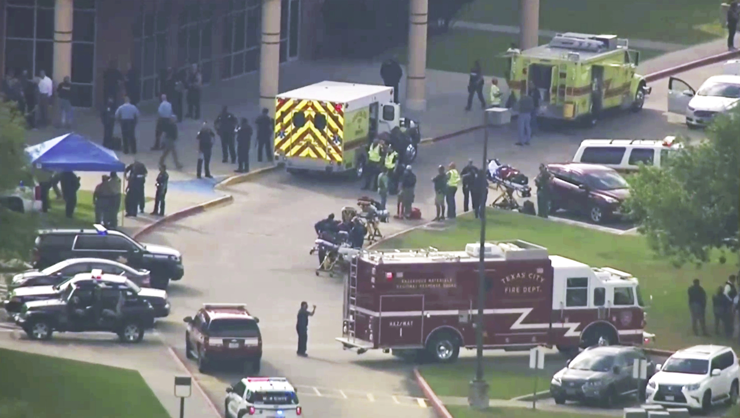 Emergency personnel and law enforcement officers respond to a high school near Houston after an active shooter was reported on campus