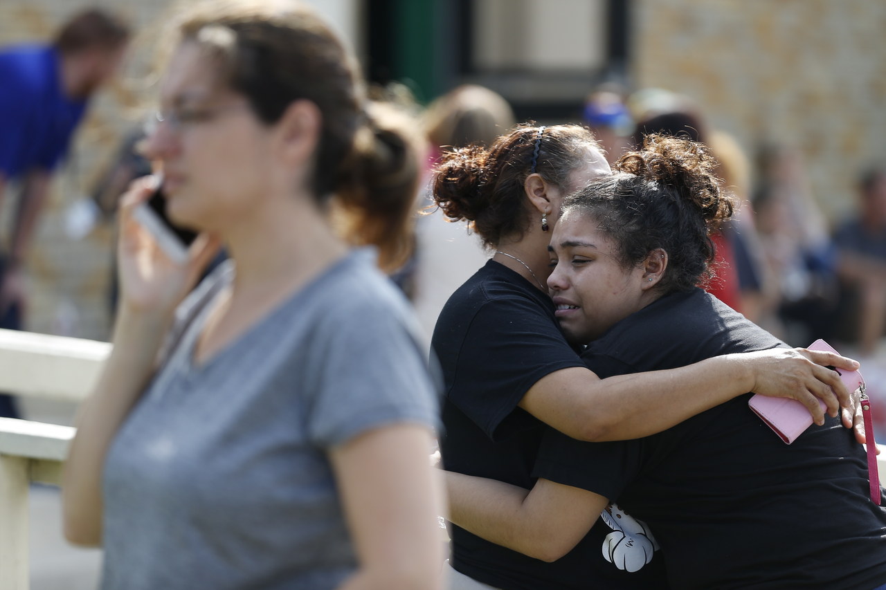 Santa Fe High School junior Guadalupe Sanchez cries in the arms of her mother, Elida Sanchez.