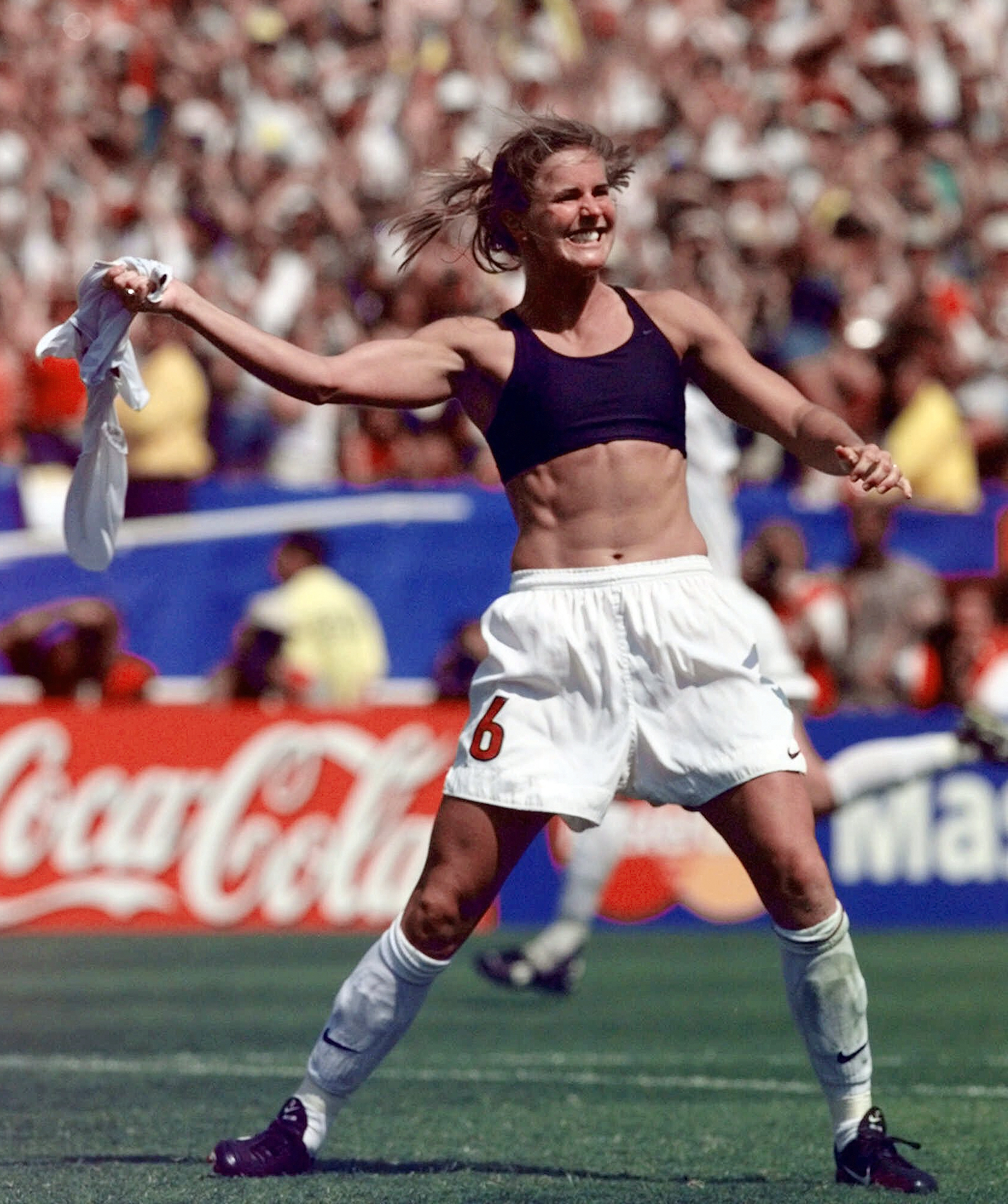Brandi Chastain rips off her jersey.