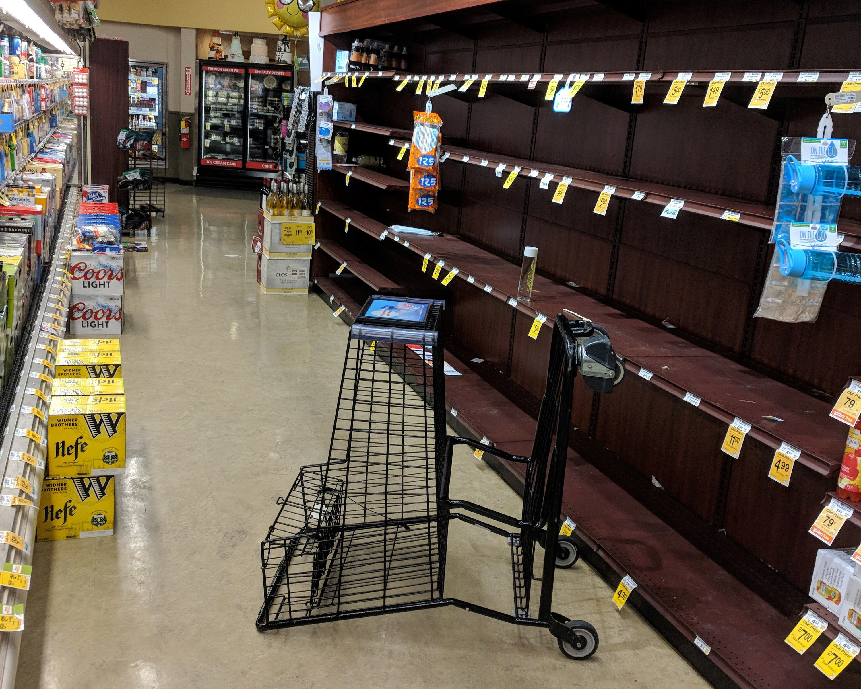 Photo of empty shelves in Salem, Oregon, after shoppers bought out all the bottled water