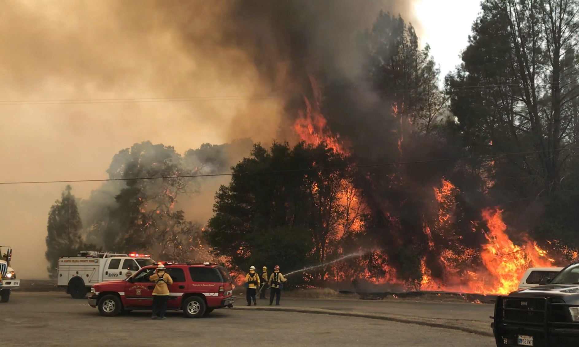 Photo of firefighters battling a wildfire northeast of Clearlake Oaks, Calif.