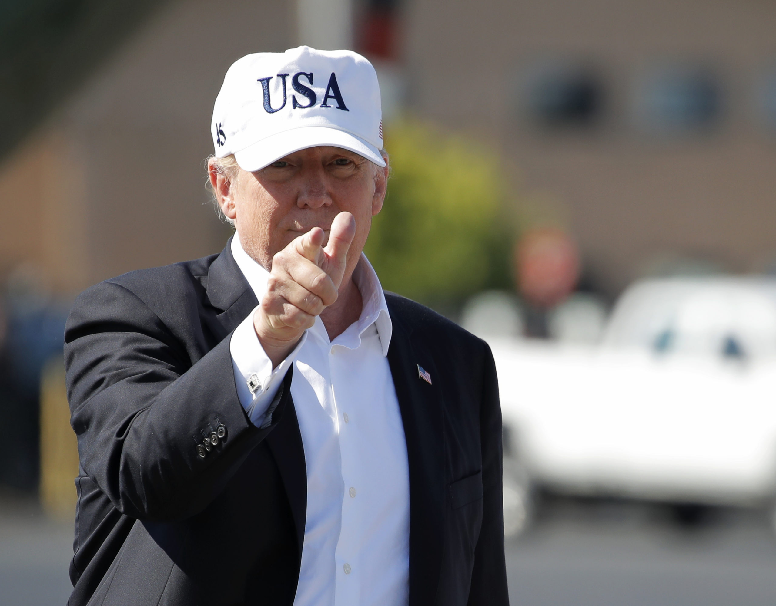 Photo of President Trump wearing white USA hat
