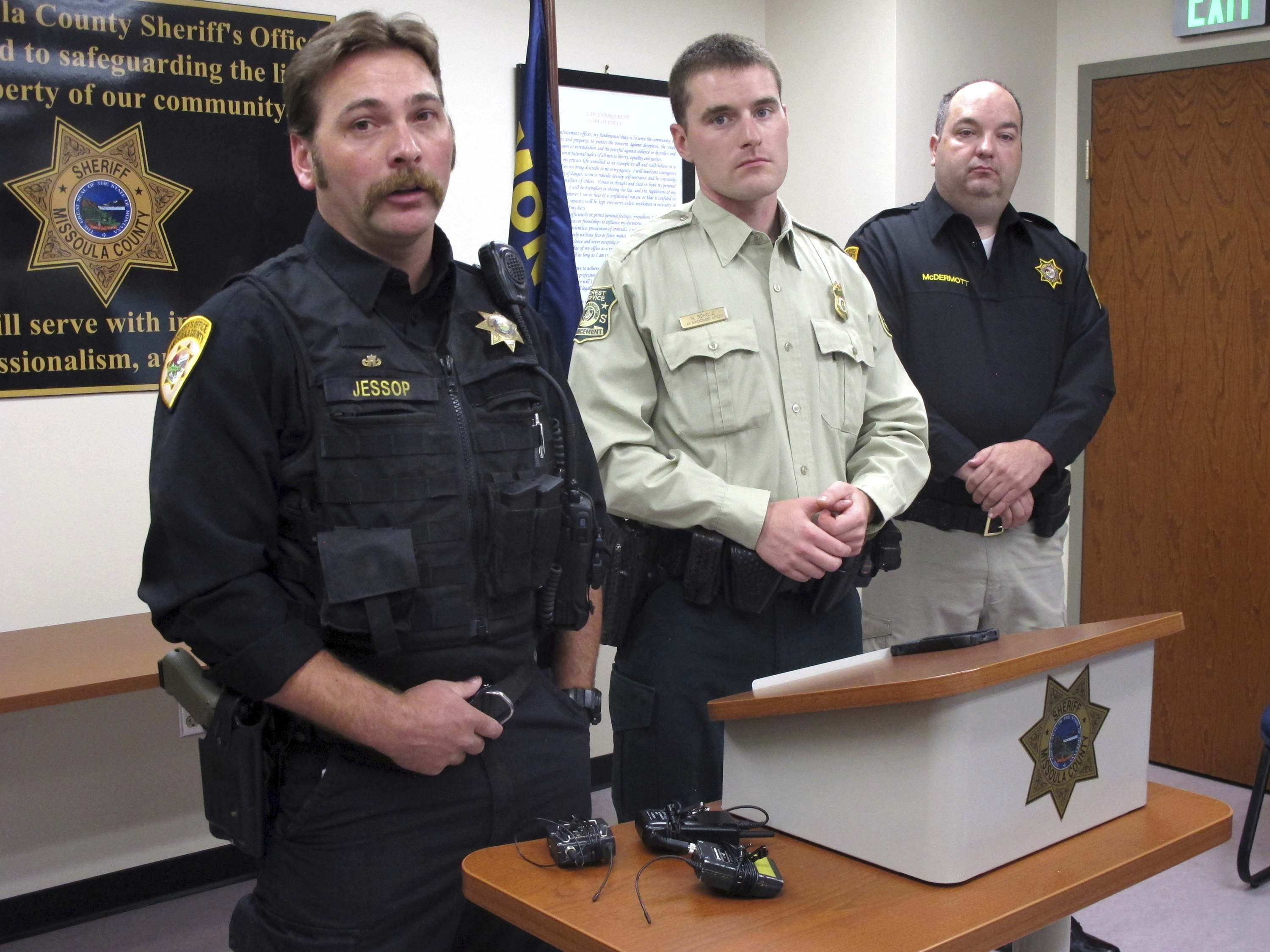 Photo of three law enforcement officers