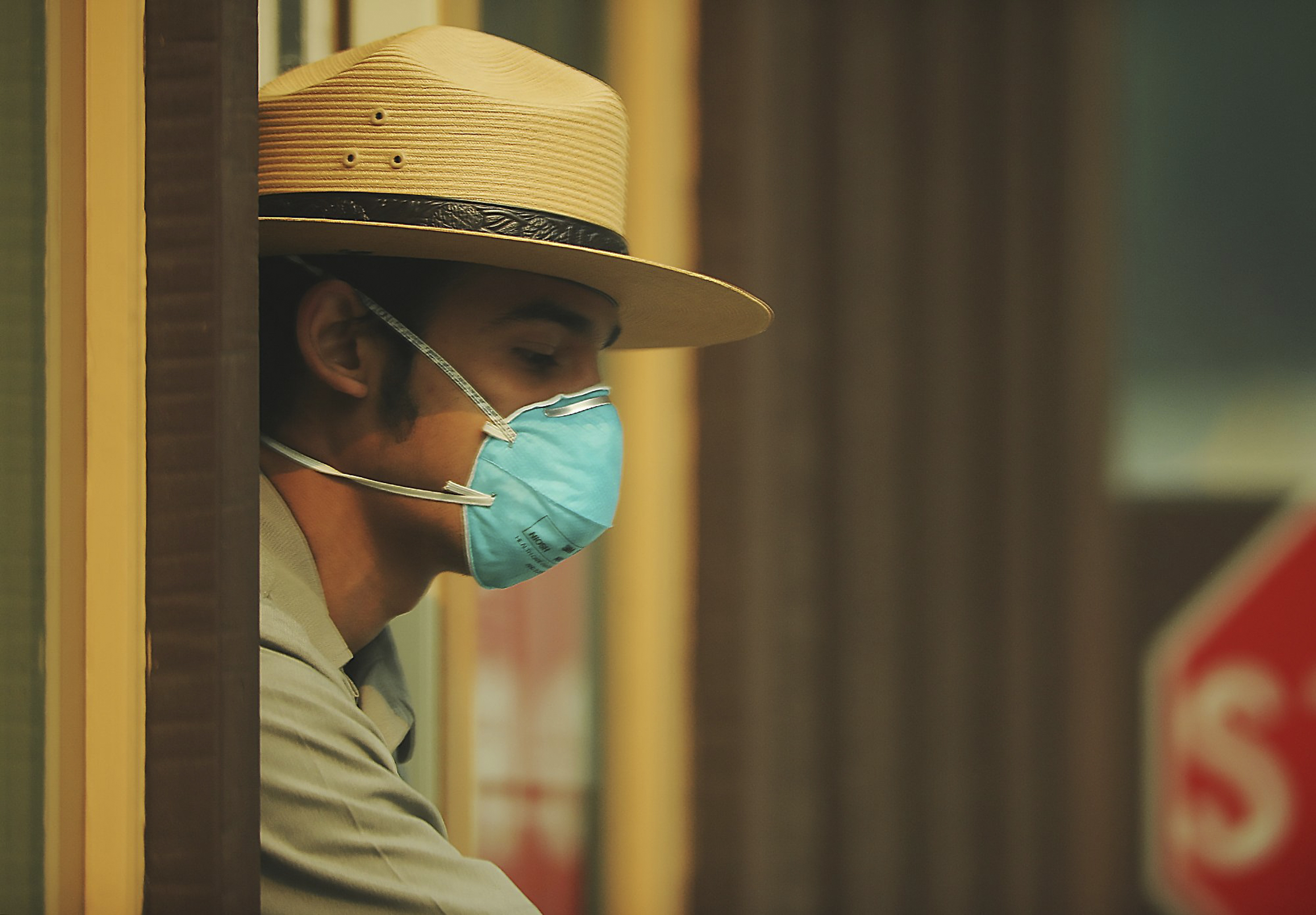 Photo of park ranger wearing mask because of bad air quality