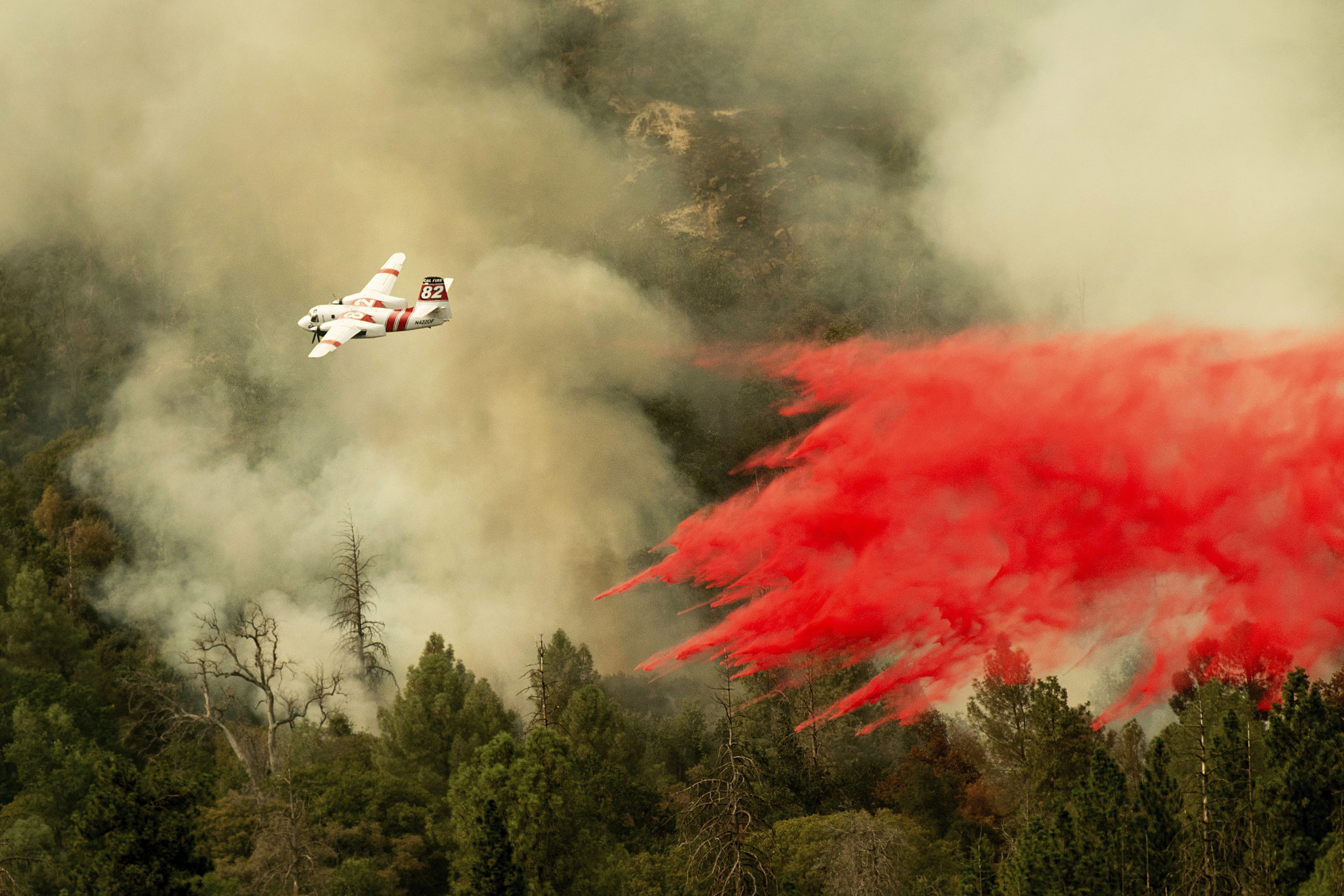 Photo of air tanker dropping retardant on the Ferguson Fire
