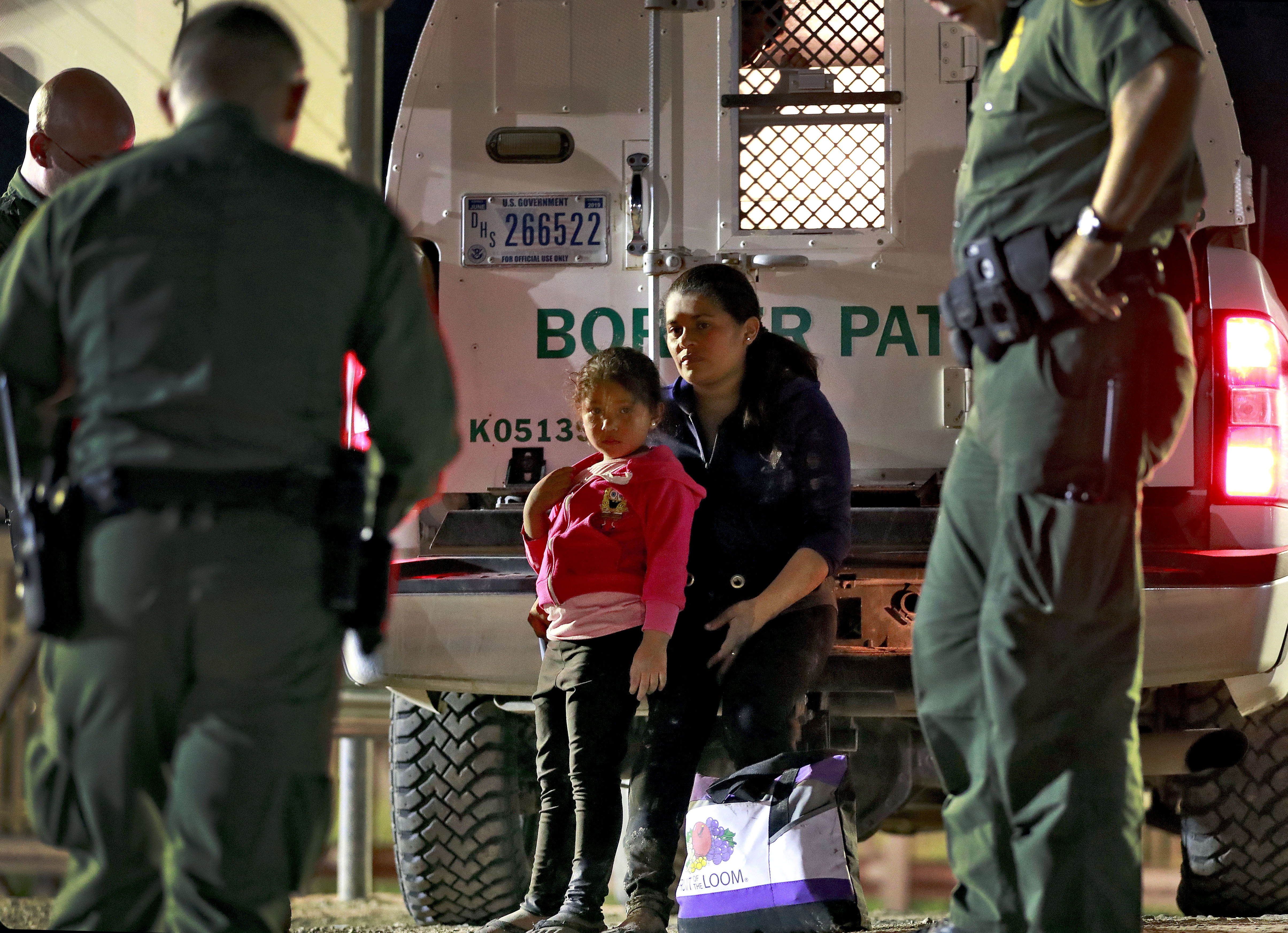 Photo of mother and daughter from Honduras detained at the U.S. border.