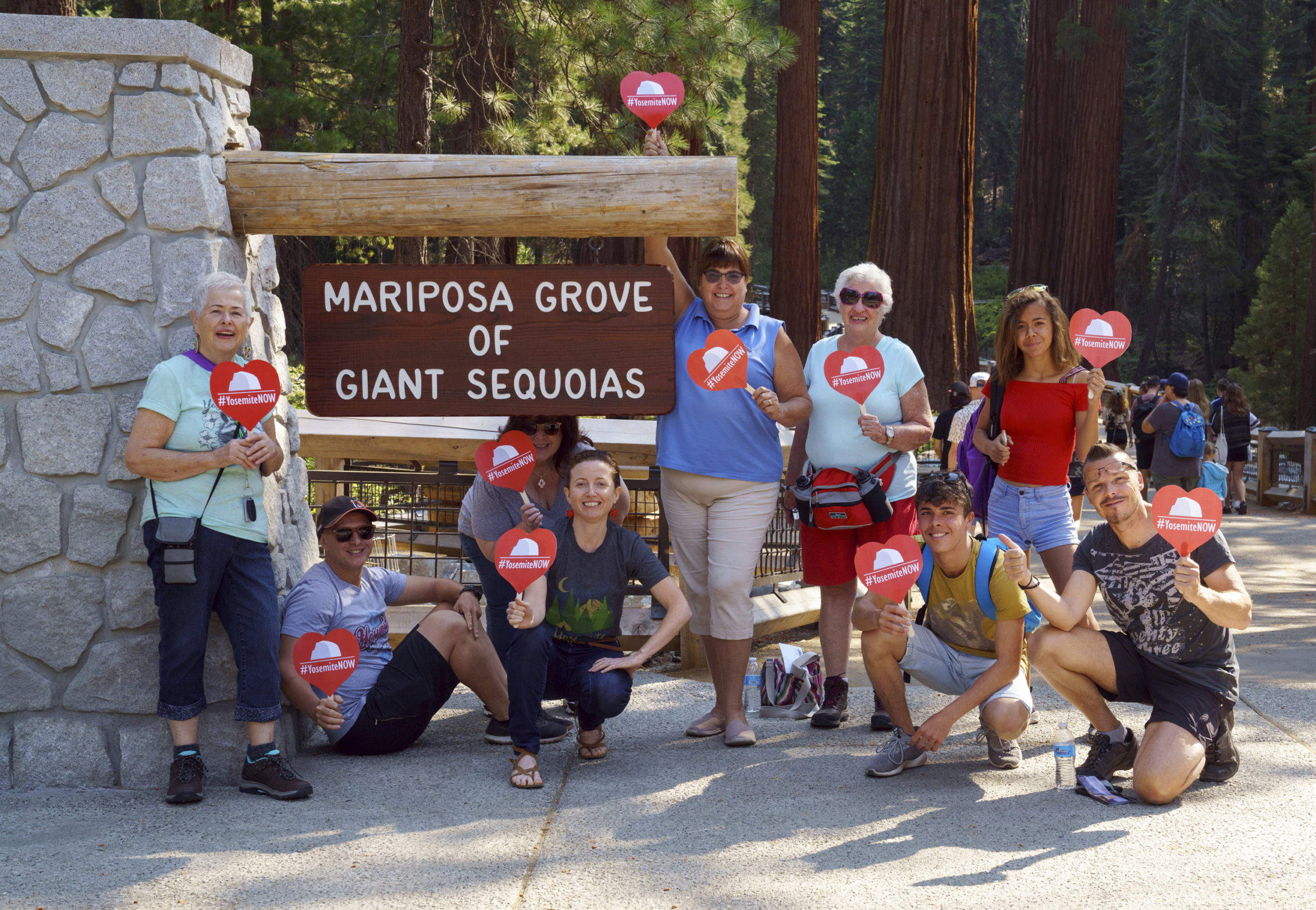 Photo of French tourists in front of the Mariposa Grove at Yosemite National Park