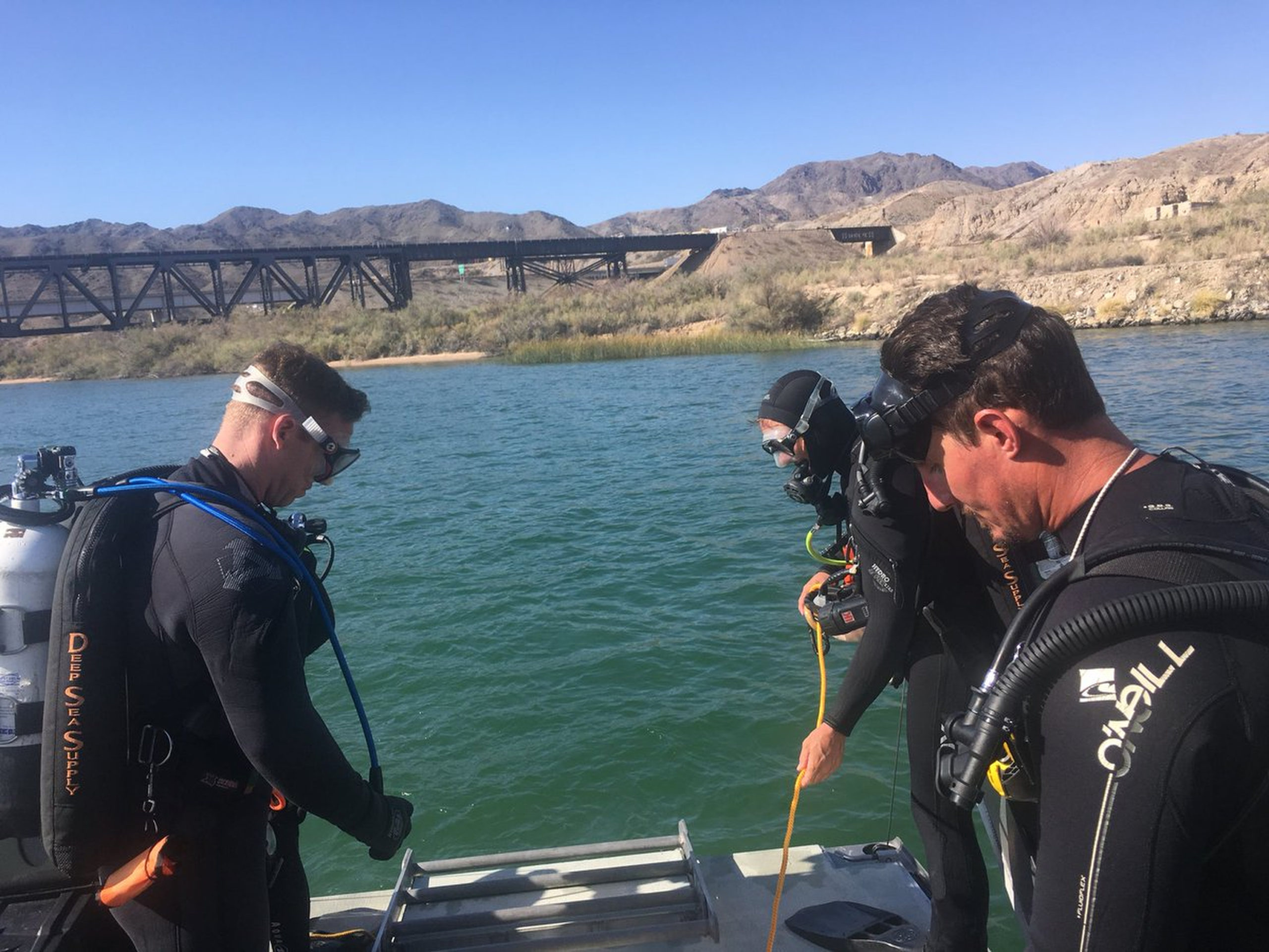 Photo of divers searching for missing people on Colorado River