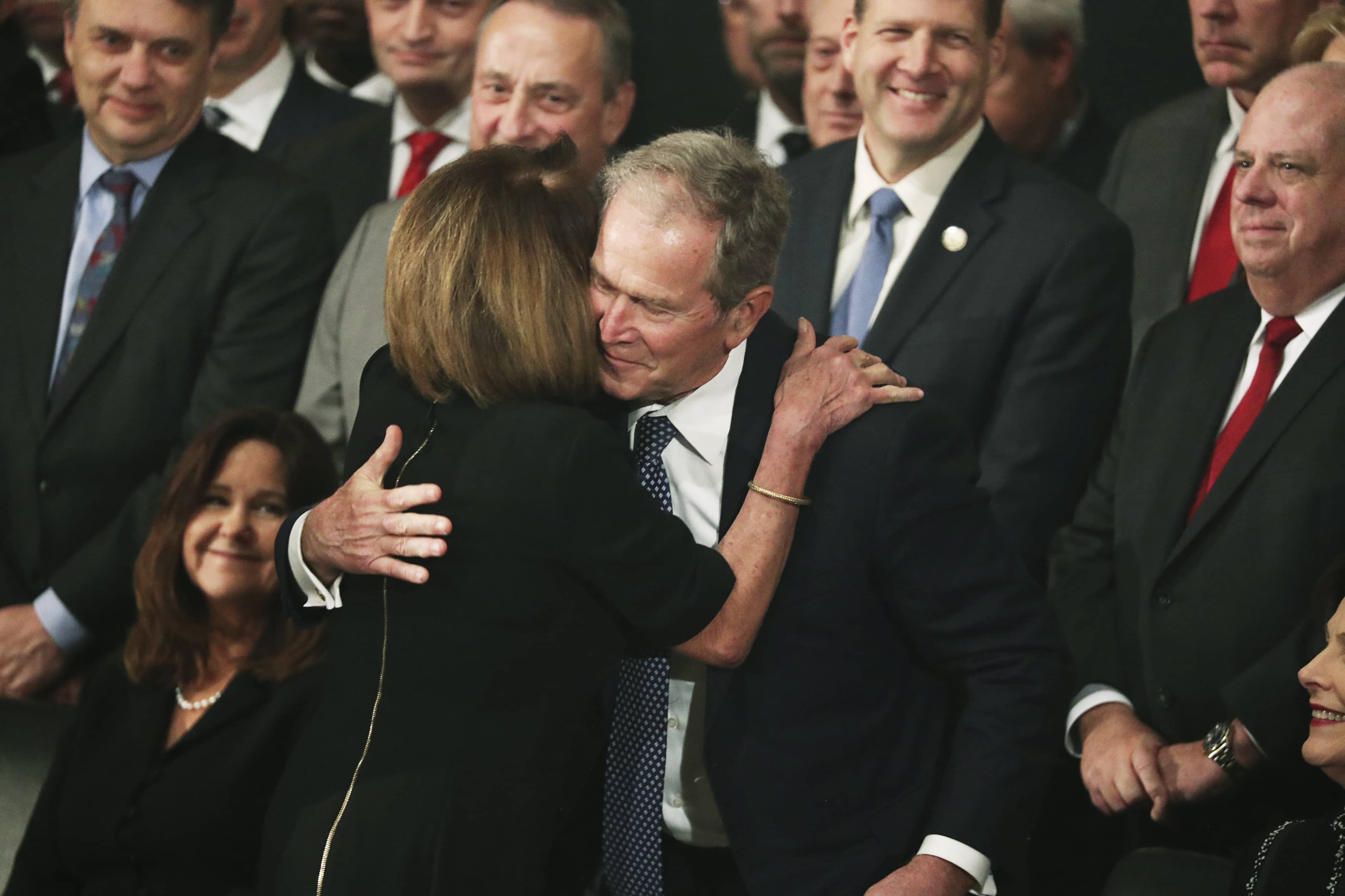 Photo of George W. Bush and Nancy Pelosi