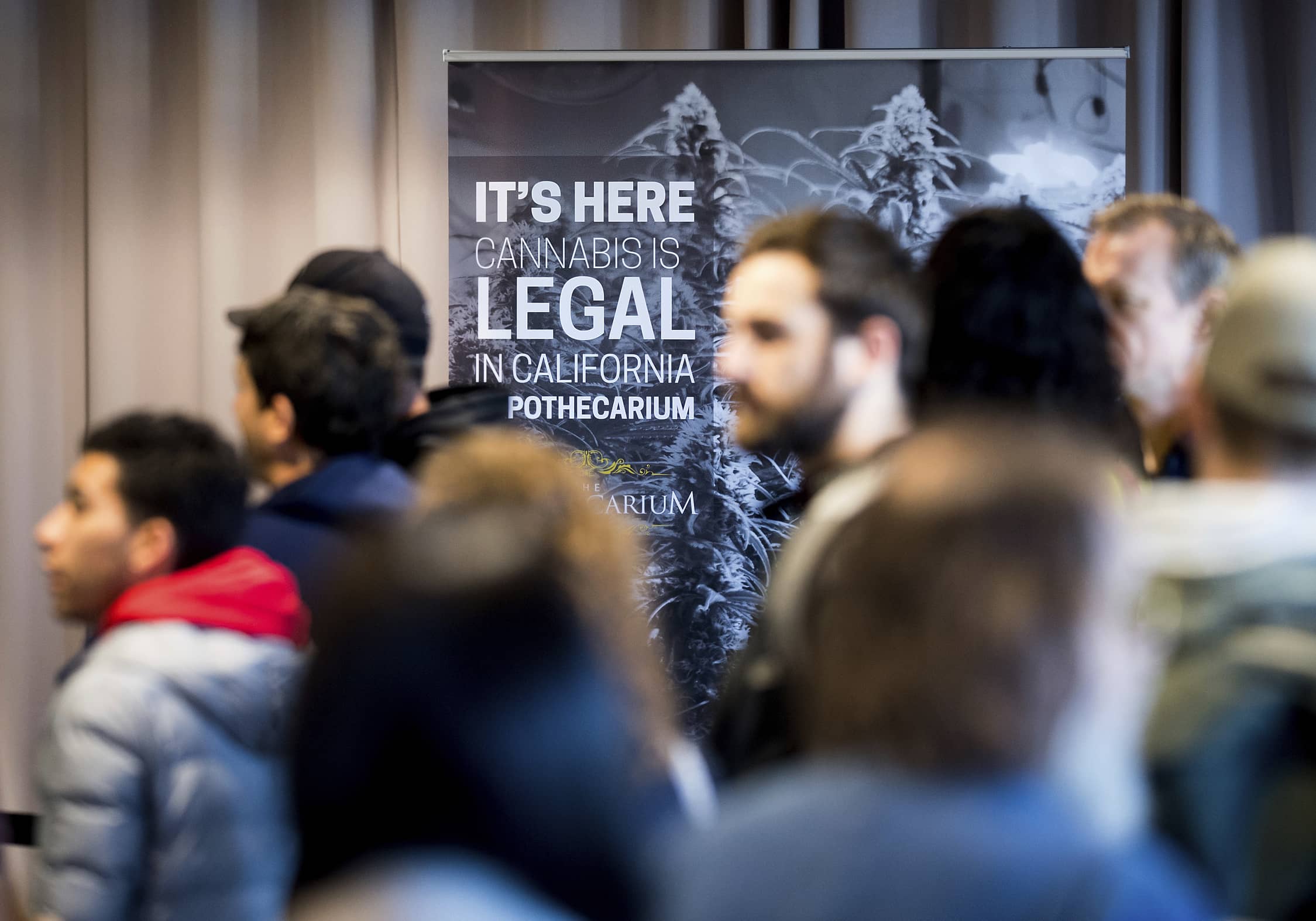 Photo of customers lining up to buy cannabis