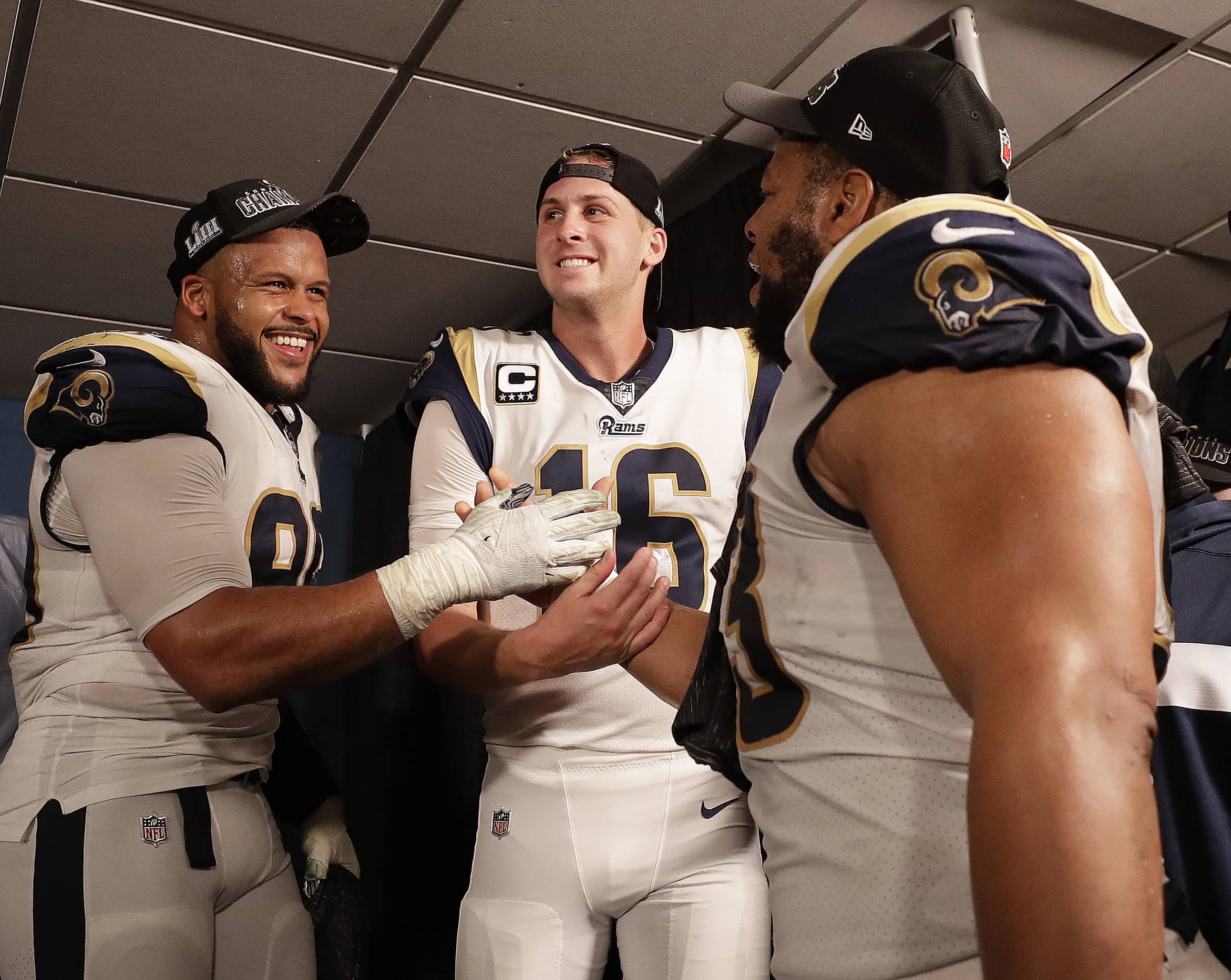 Photo of os Angeles Rams defensive end Aaron Donald (99) Los Angeles Rams nose tackle Ndamukong Suh (93) and Los Angeles Rams quarterback Jared Goff (16)