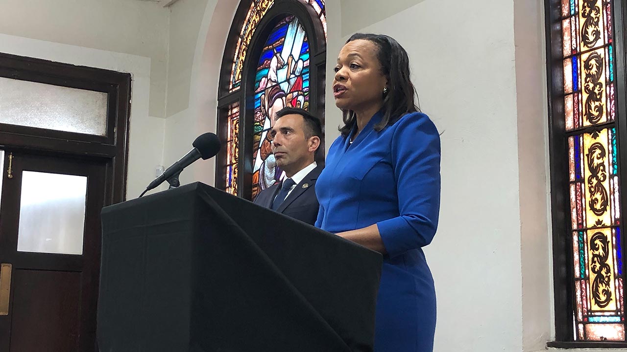 Assistant Attorney General of the U.S. Department of Justice's Civil Rights Division Kristen Clarke, right, speaks next to United States Attorney Martin Estrada, of the California central division, while announcing the largest redlining settlement in American history.