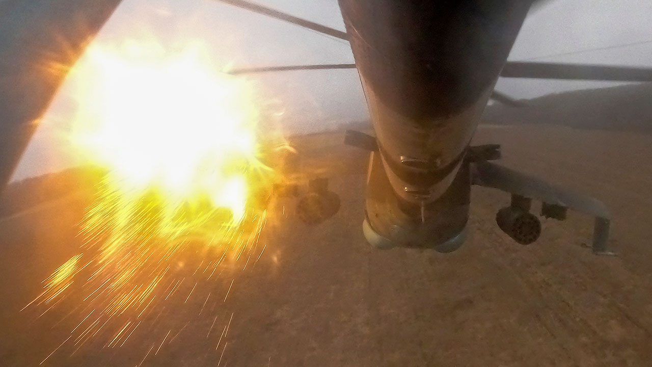A Ukrainian Mi-24 attack helicopter releases flares.