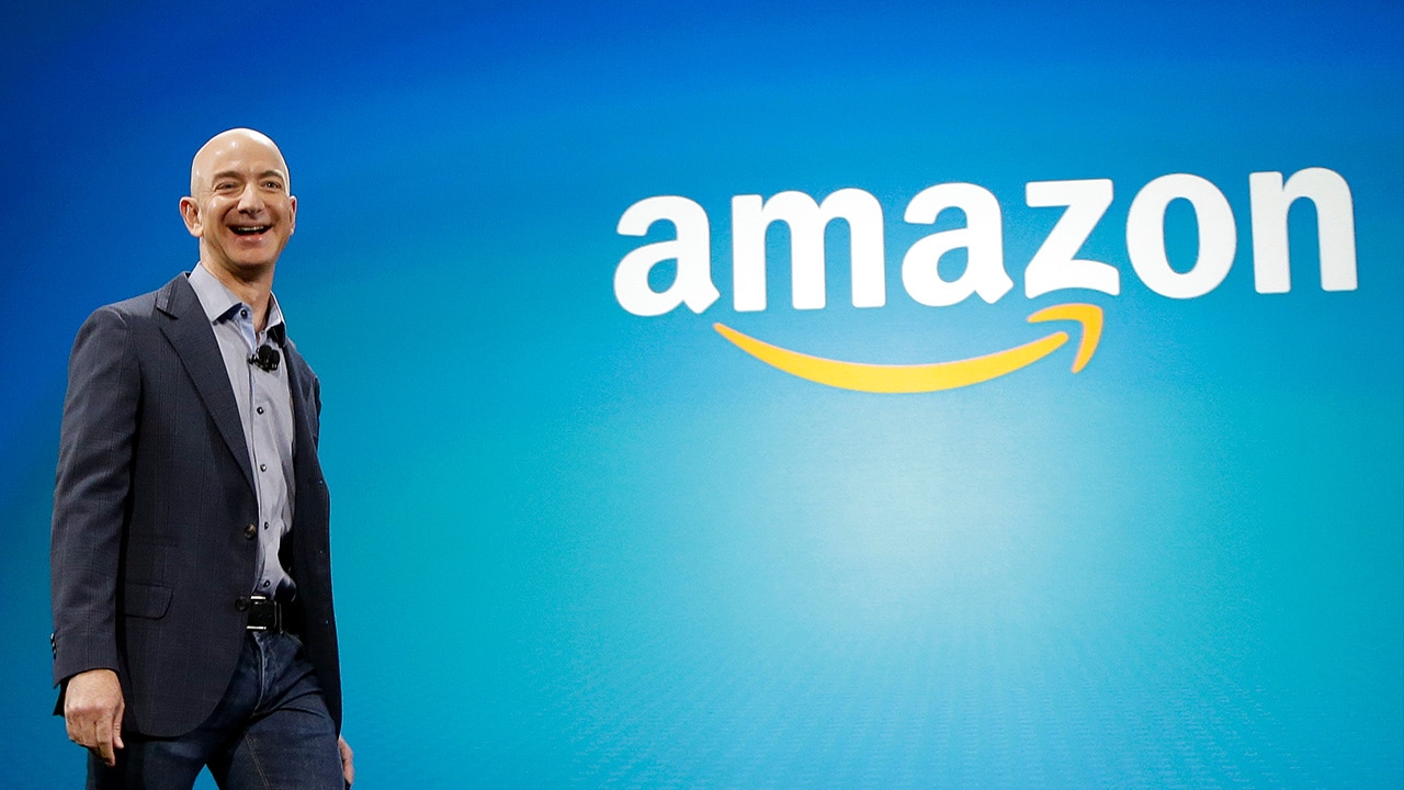 Photo of Amazon CEO Jeff Bezos walking on stage in 2014