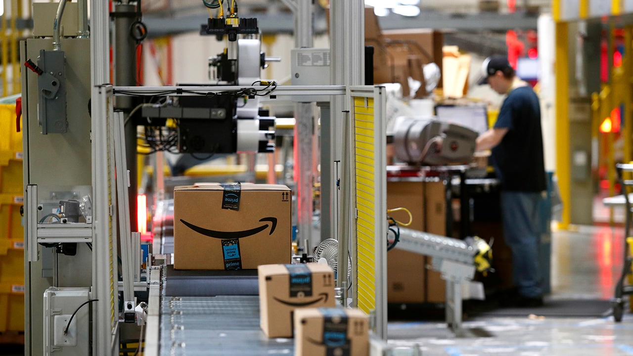 Photo of Amazon packages passing through a scanner at an Amazon fulfillment center in Baltimore