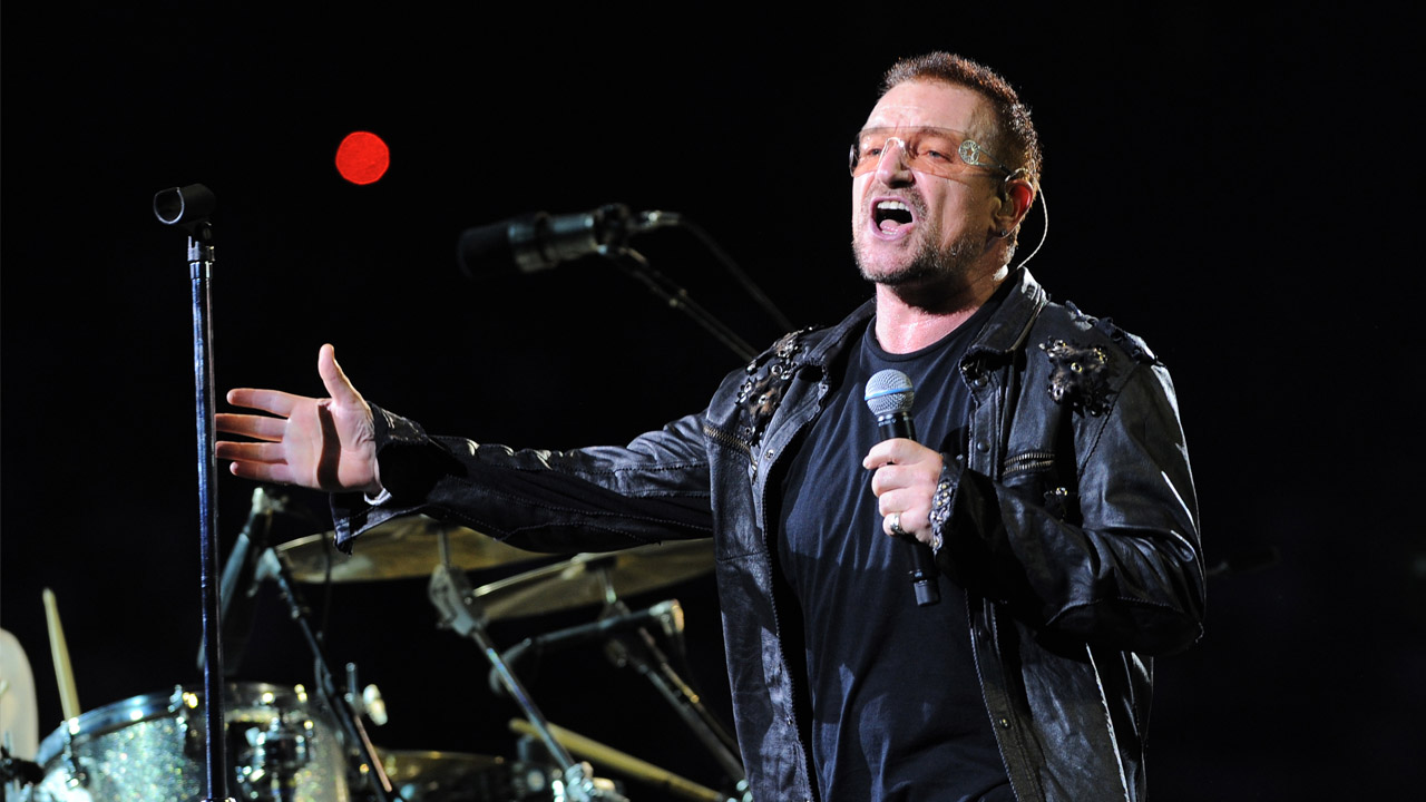 U2 lead singer Bono performing on stage