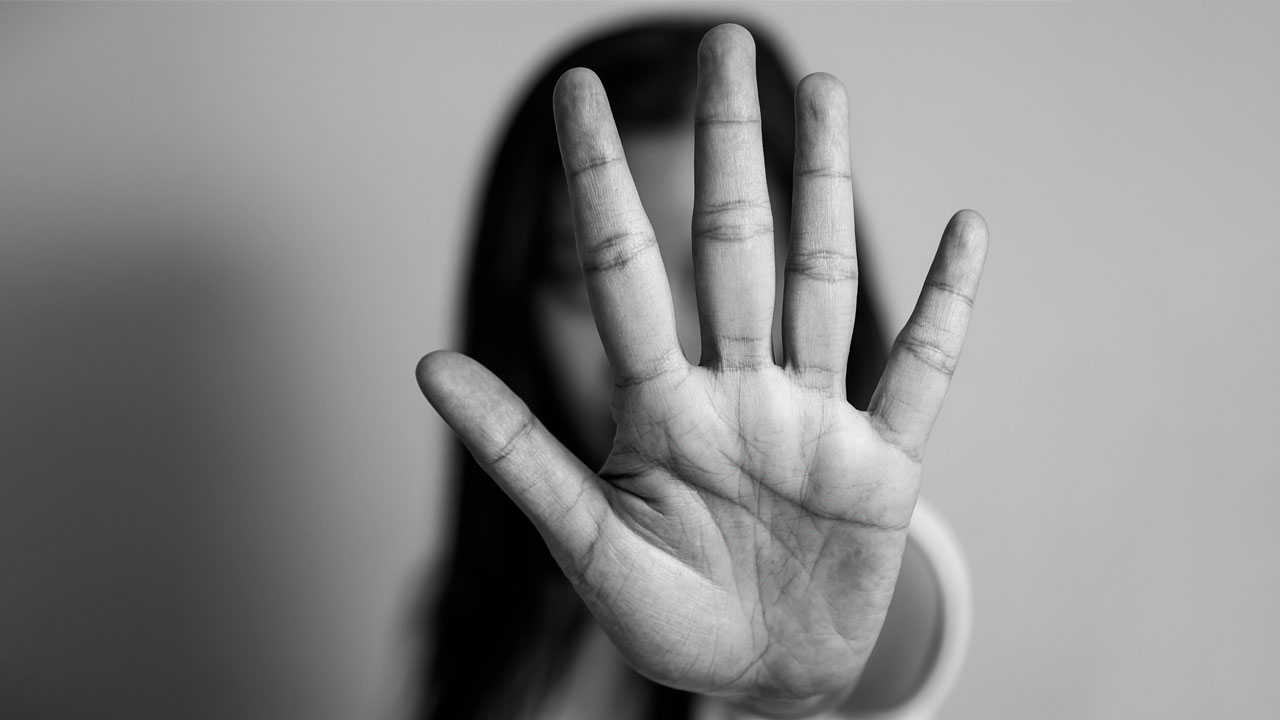 Photo of a girl with her hand to the camera