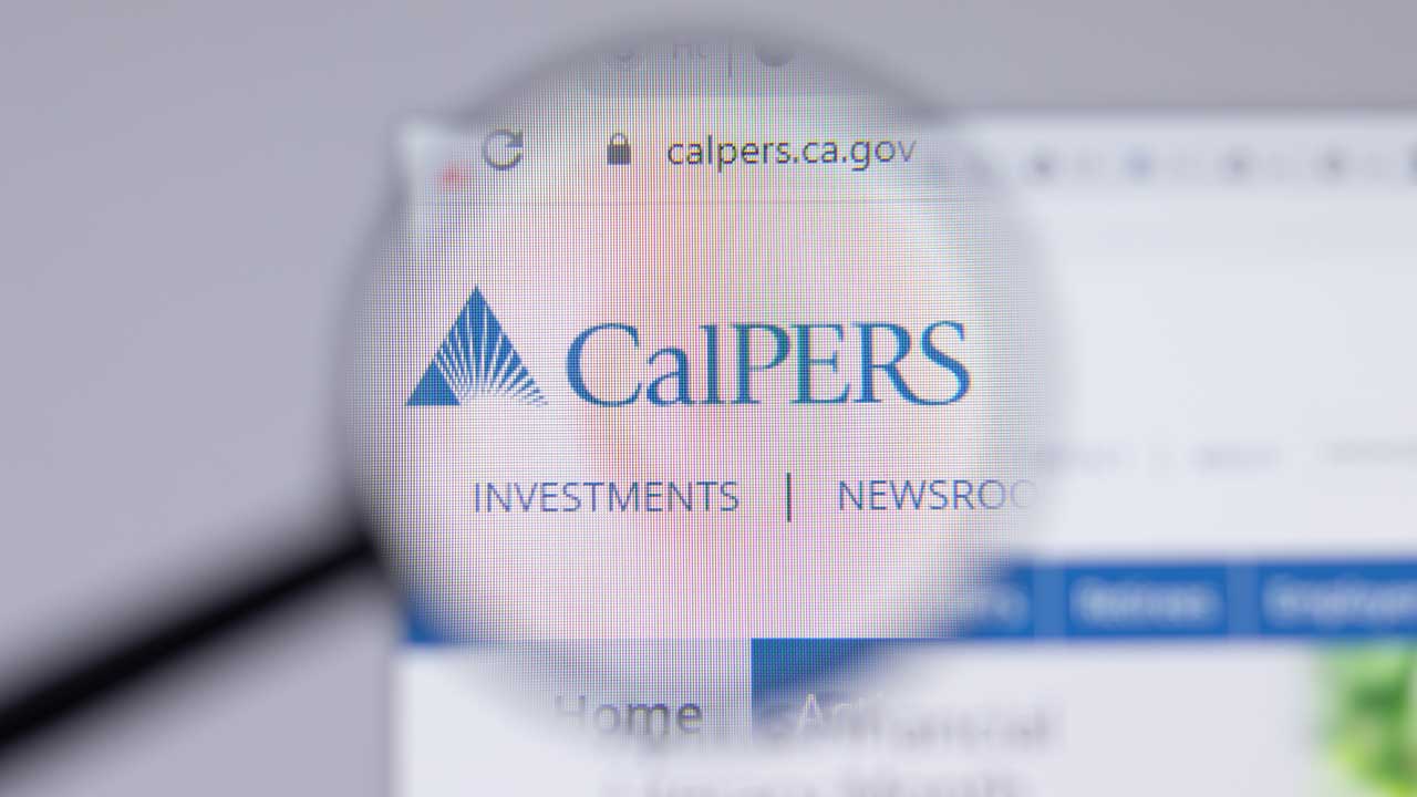 Image of a magnifying glass over the CalPERS website. The colors are blue and white