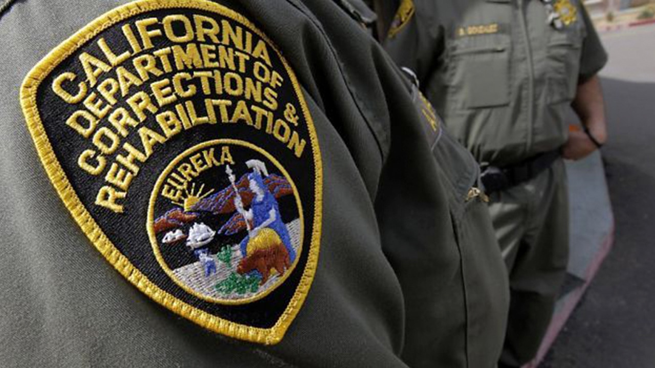 Photo of California Department of Corrections patch on correctional officer's uniform