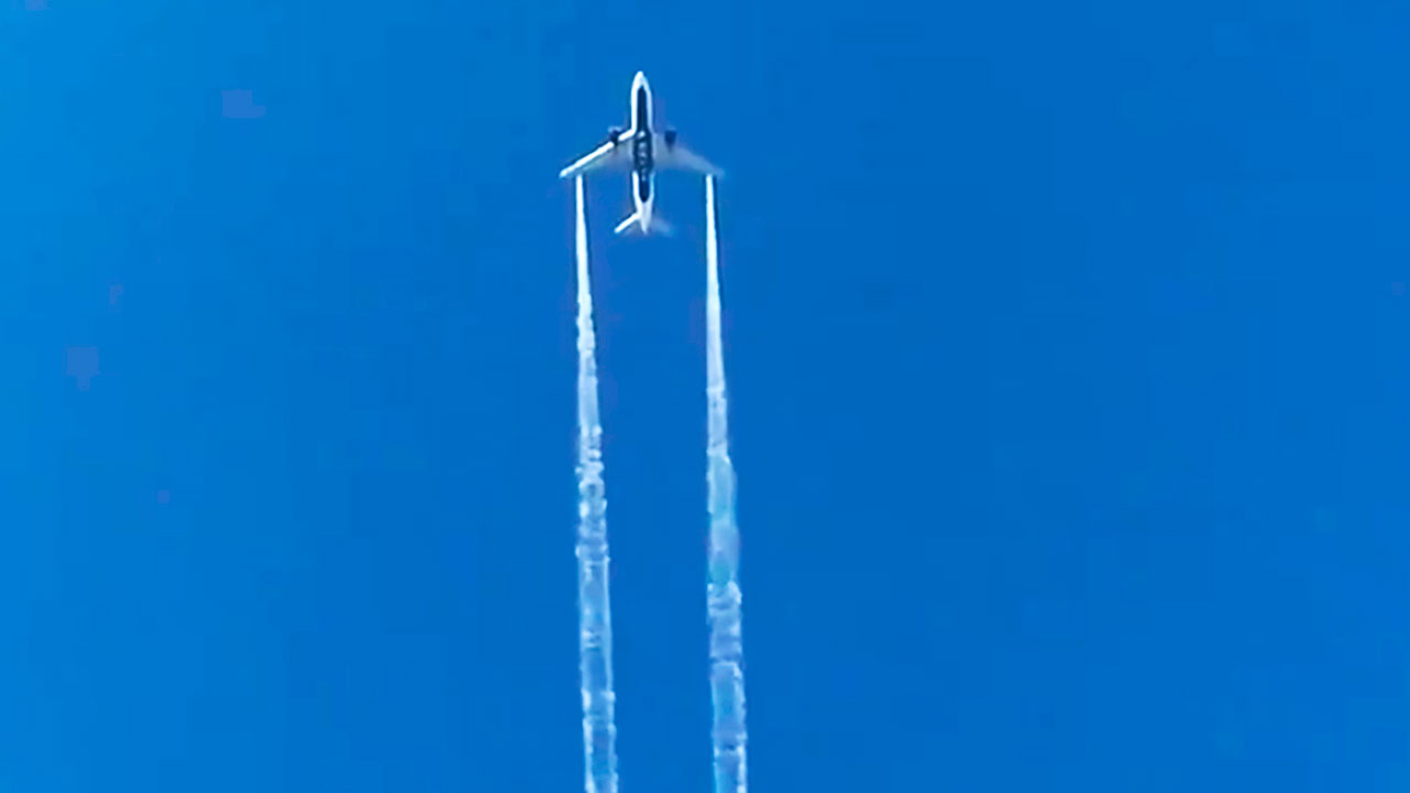 Photo of a plane flying in the sky