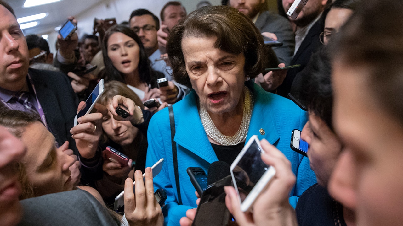 Photo of Dianne Feinstein responding to reporters