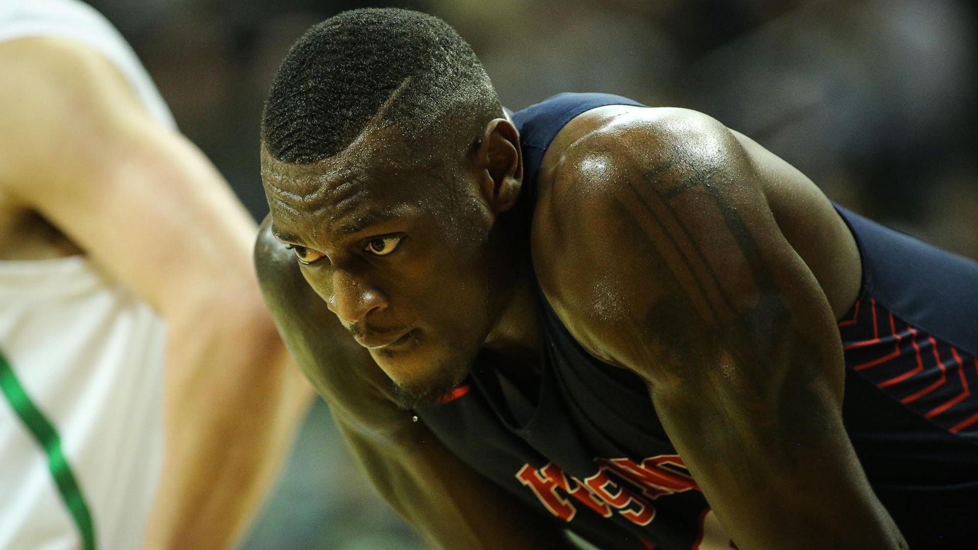 Photo of Nate Grimes bent at the waist