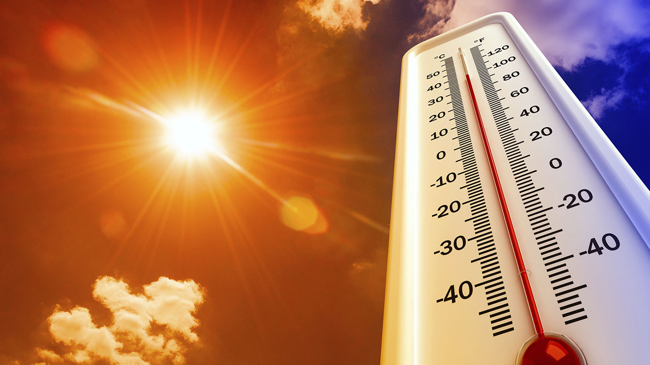 Photo illustration of heatwave and thermometer
