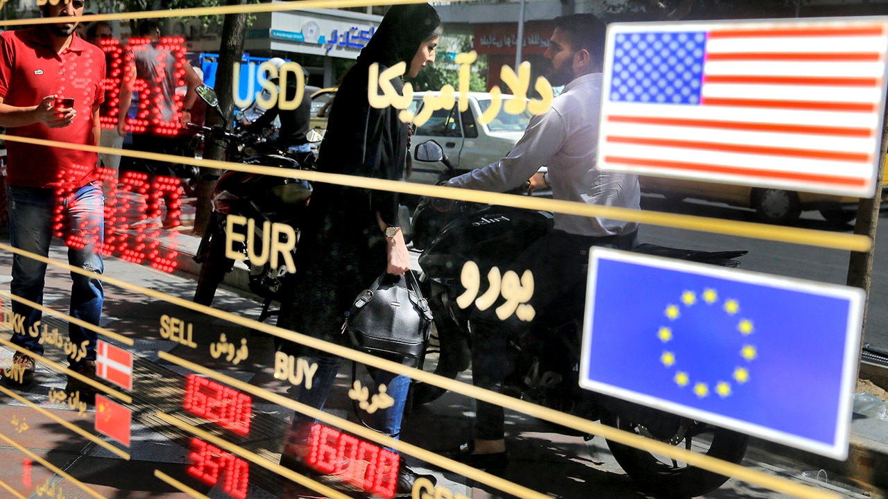 Photo of currency rates displayed at a window of an exchange shop in downtown Tehran, Iran