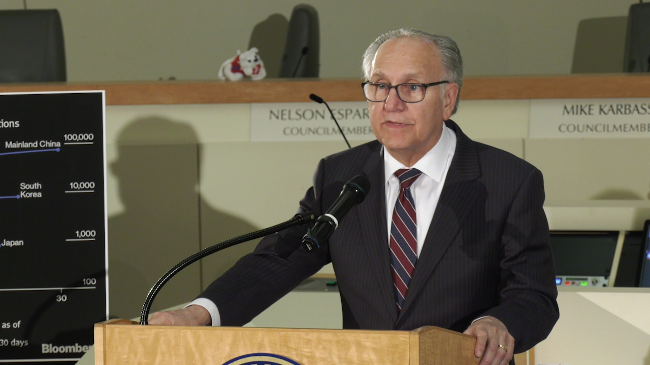 Photo of Fresno Mayor Lee Brand speaking inside City Hall at a podium