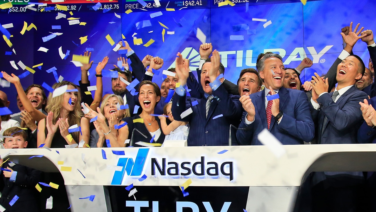 Photo of Brendan Kennedy, CEO and founder of British Columbia-based Tilray Inc., a major Canadian marijuana grower, leading cheers as confetti falls to celebrate