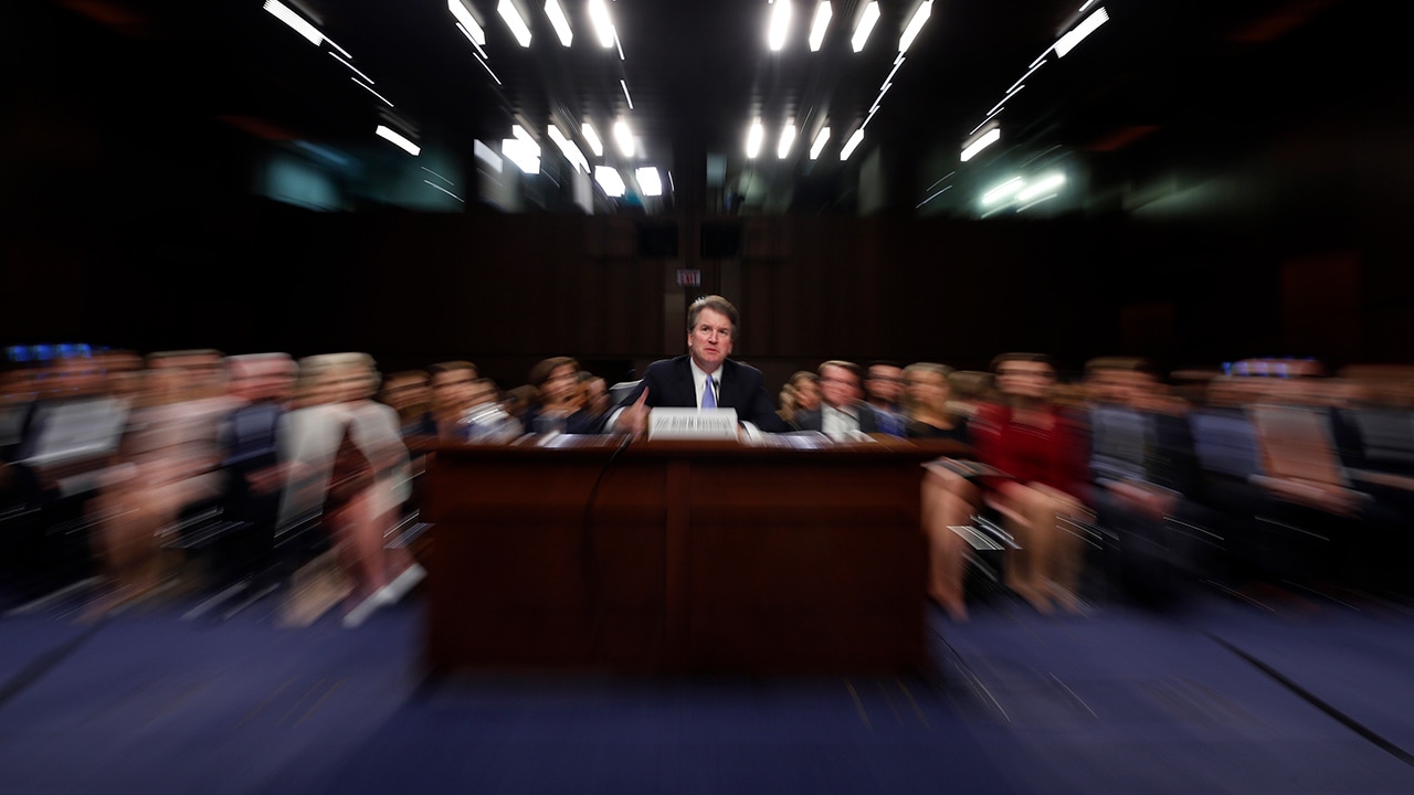Photo of Kavanaugh in court with a slow shutter speed effect