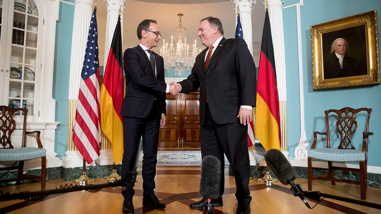 Photo of Secretary of State Mike Pompeo shaking hands with German Foreign Minister Heiko Maas