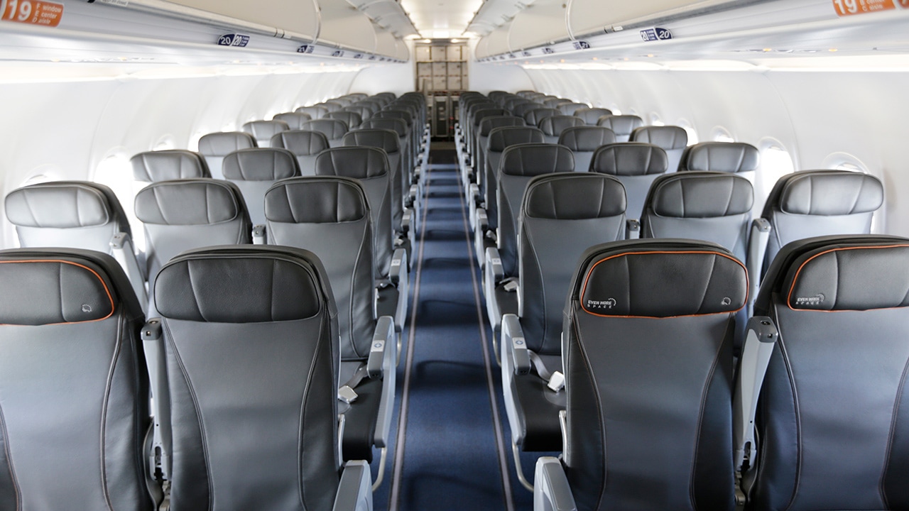 Photo of airplane seats inside a commercial airliner at JFK