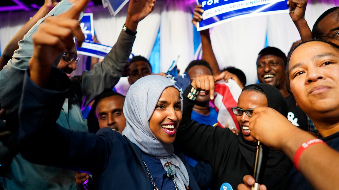 Photo of Minnesota Rep. Ilhan Omar celebrating with her supporters