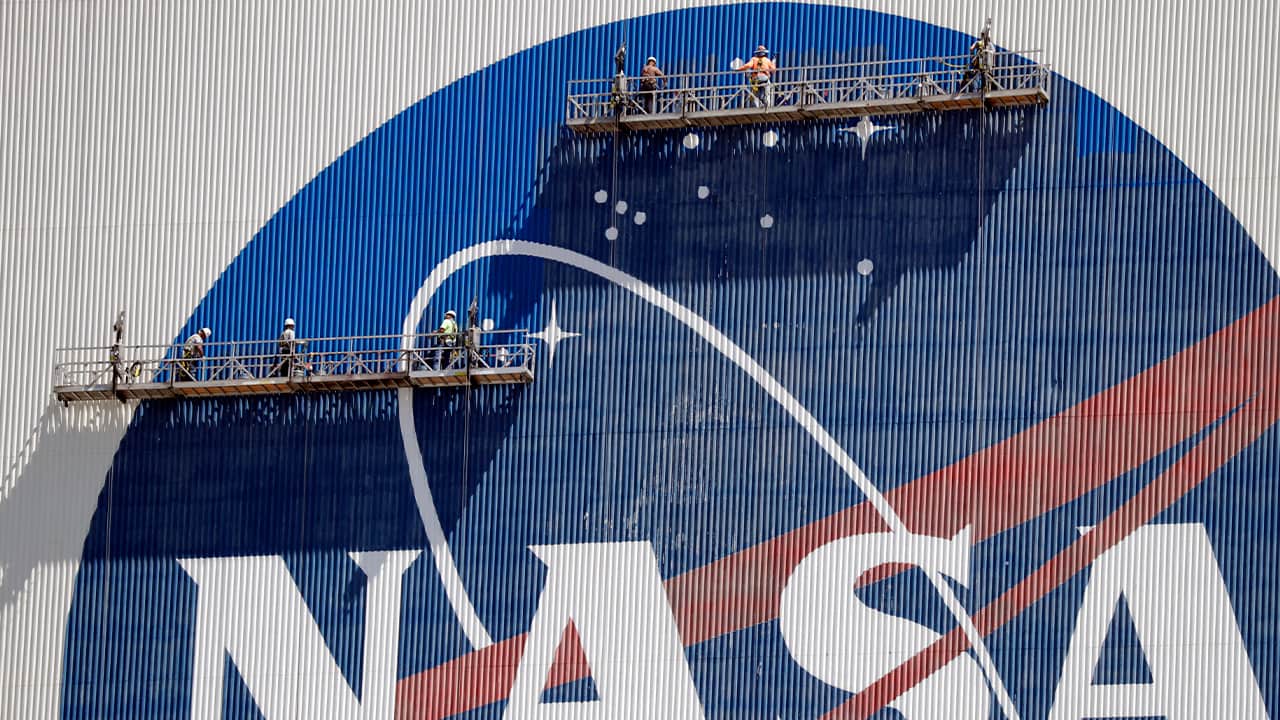 Photo of workers on a NASA building 