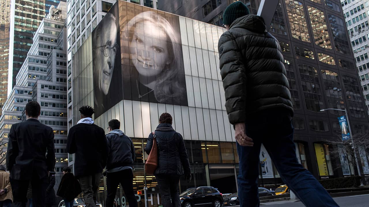Photo of the building with pictures of Harry Macklowe and his new wife, Patricia Landreau