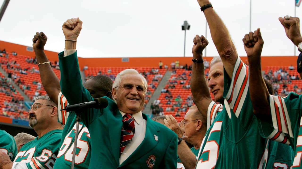 Former Miami Dolphins coach Don Shula, left, and player Nick Buoniconti, right, wave during a halftime ceremony