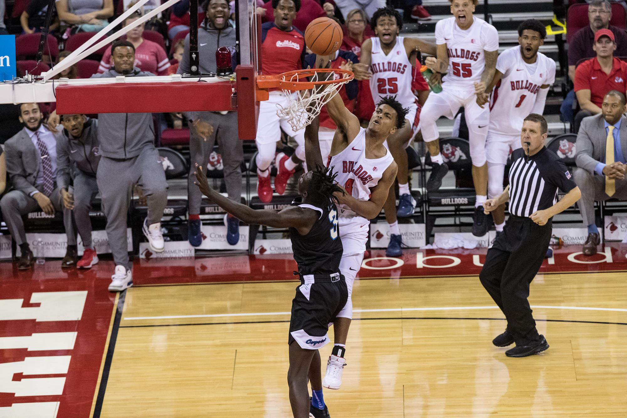 Photo of Fresno State's Niven Hart dunking against San Jose State