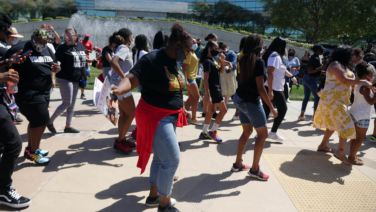 Image of residents dancing in front of Fresno City Hall after signing of Black Lives Matter Day proclamation