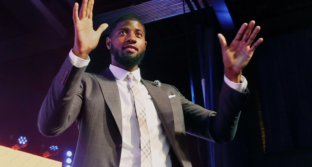 Photo of Paul George in a suit