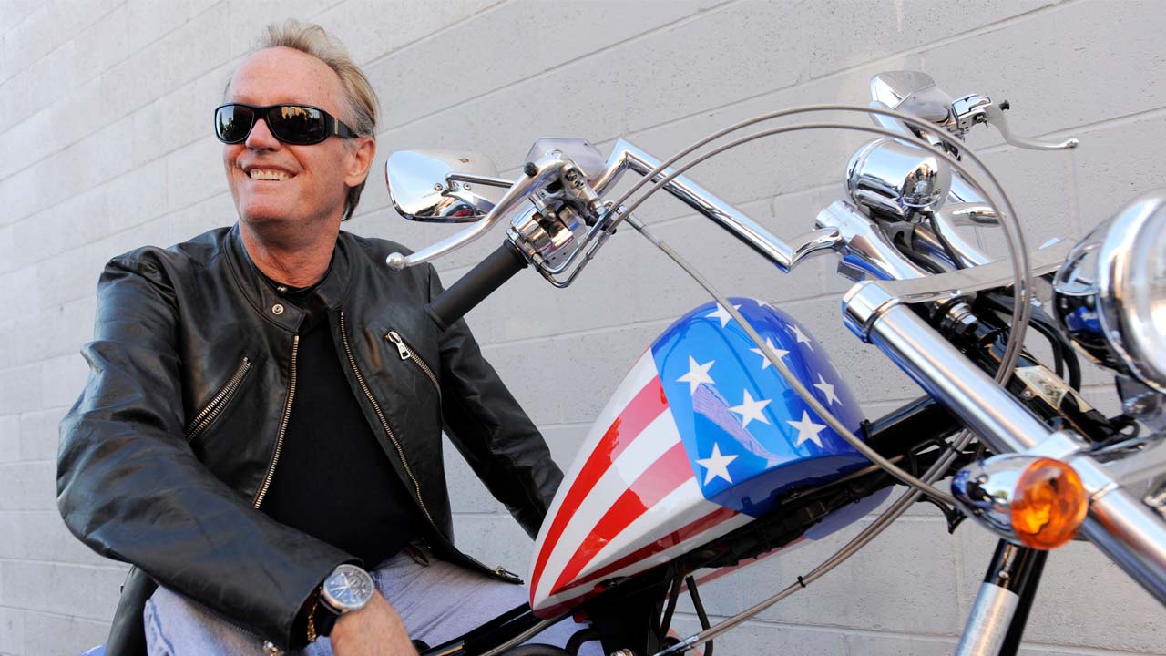 Photo of Peter Fonda on the chopper motorcycle he made famous in Easy RiderDo