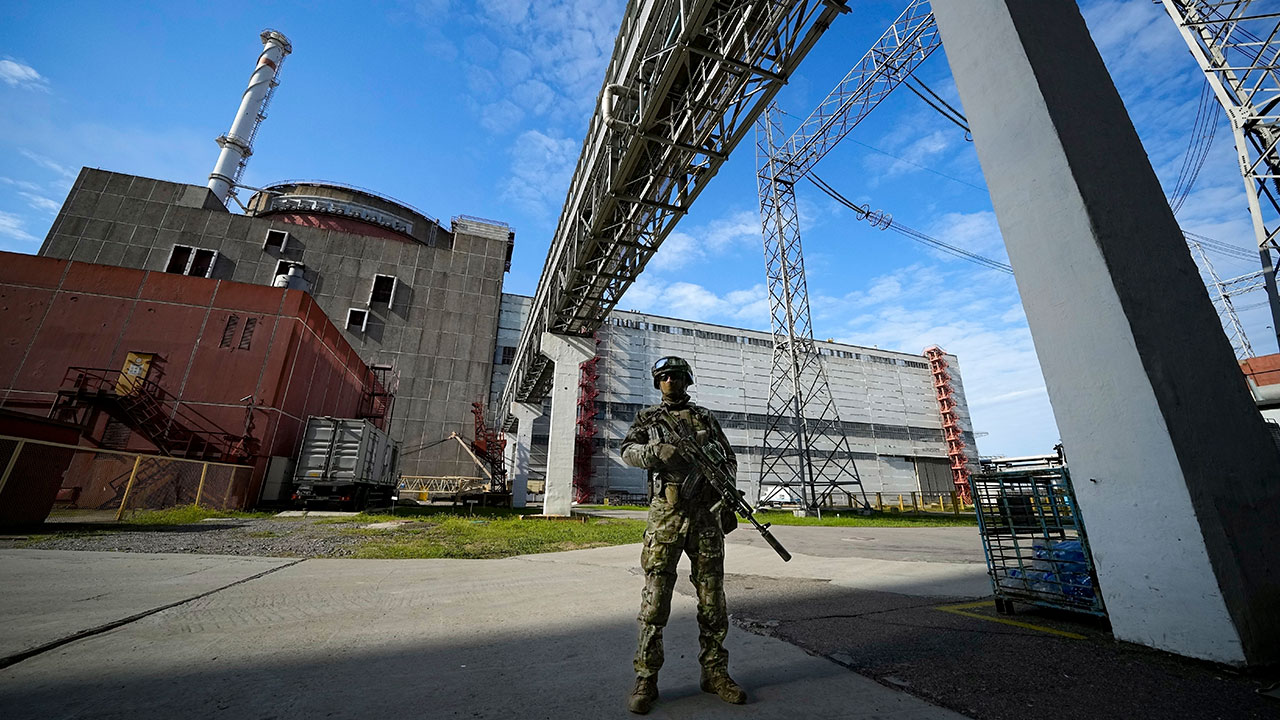 A Russian serviceman guards an area of the Zaporizhzhia Nuclear Power Station
