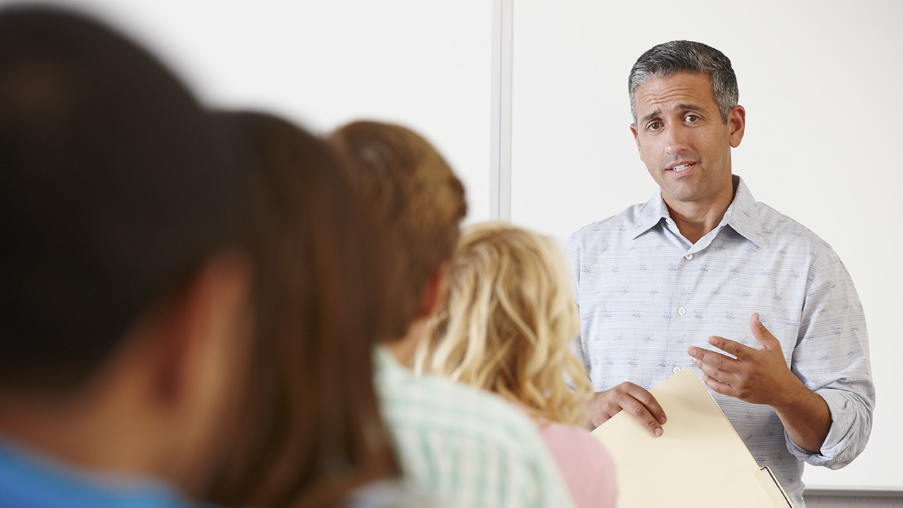Teacher speaking in front of class