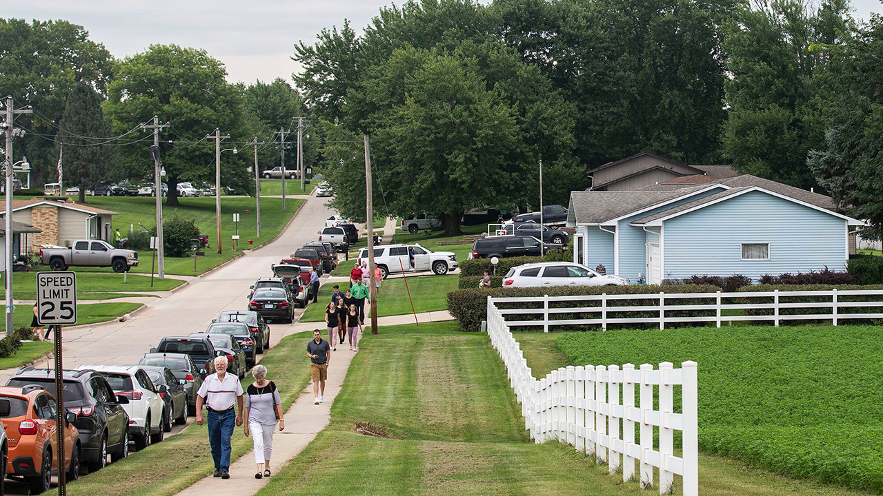 Photo of people walking blocks to attend Mollie Tibbetts' funeral in Brooklyn, Iowa