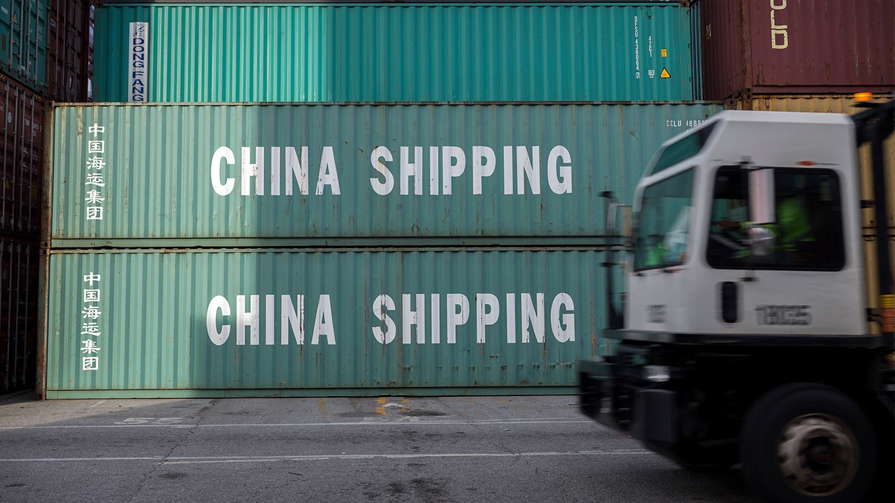 Photo of truck passing China Shipping containers in Savannah, GA
