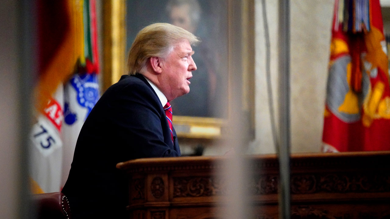 Photo of President Donald Trump talking to the nation from the Oval Office.