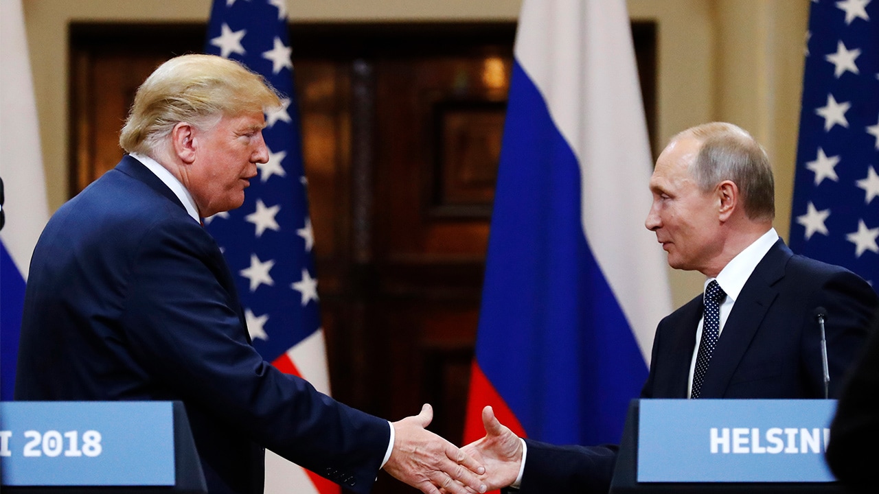 Photo of Trump and Putin shaking hands