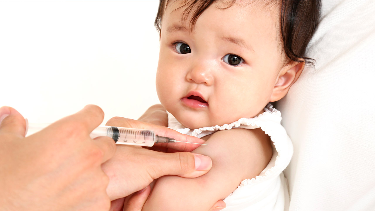 Young child receiving vaccination.